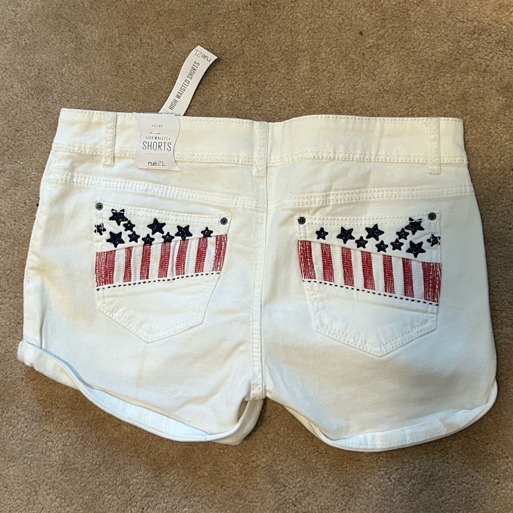 White womens shorts with American flag on back pockets